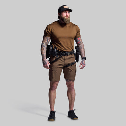 Man wearing tactical gear on a gray background