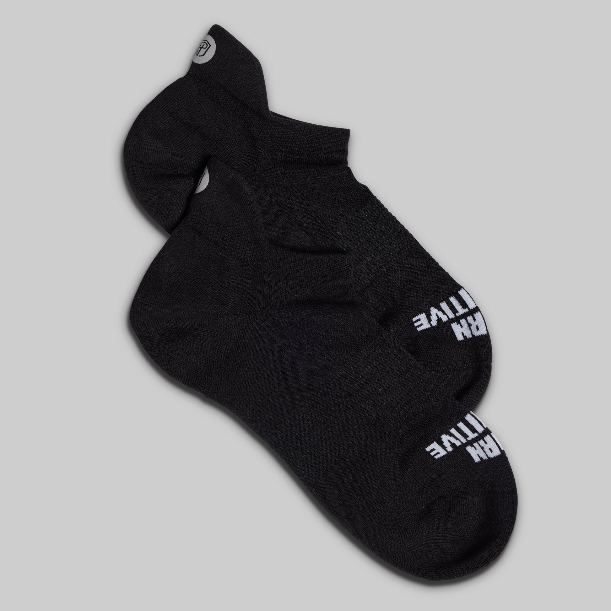 Black sock with white text on a gray background