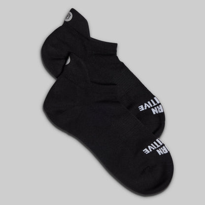 Black sock with white text on a gray background