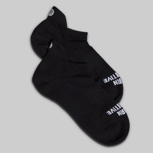 Black sock with white text on a gray background