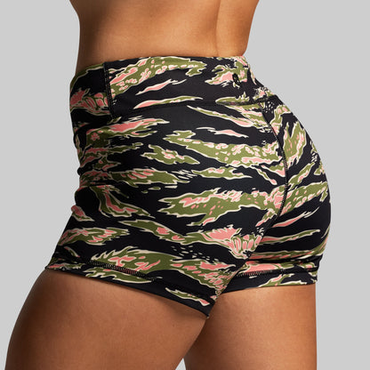 Mid rise shorts with a camouflage pattern on a gray background